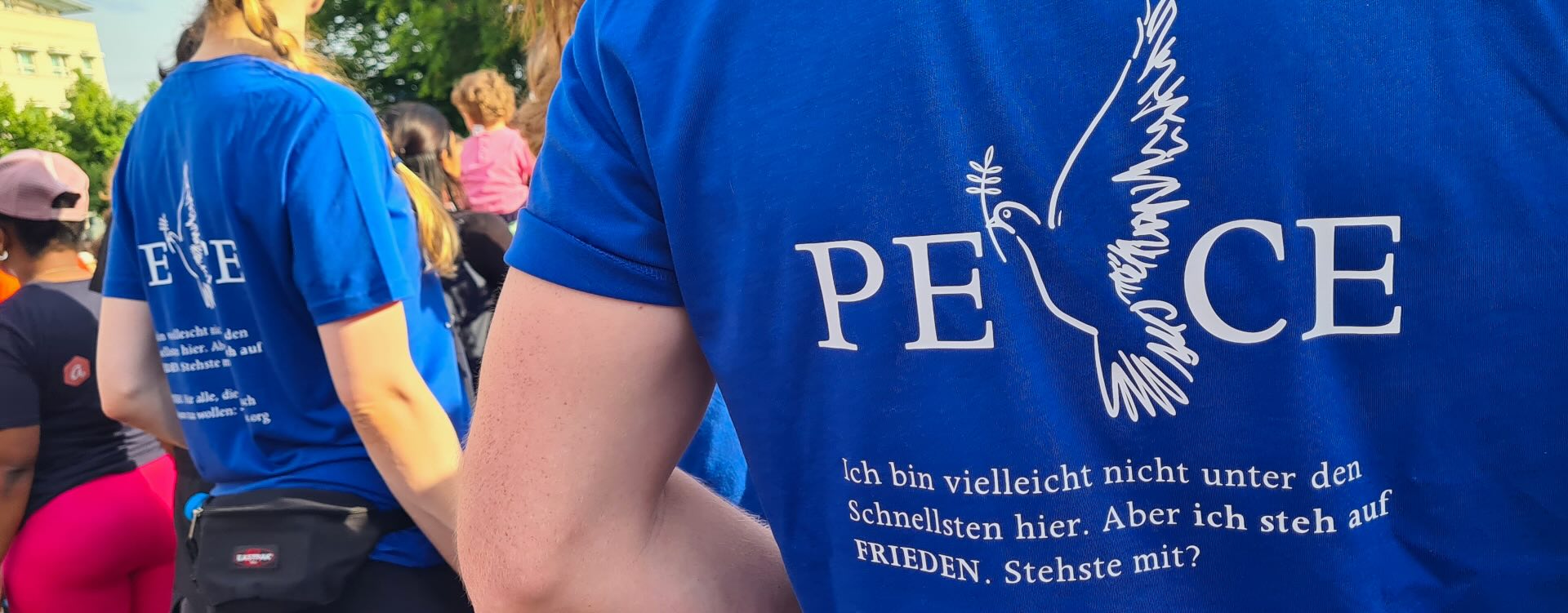 In a world of conflict a running shirt for PEACE. Sportswear for corporate events - I ran myself quite a few mini runs and had the cam with me to capture the creations in action, getting inspired and optimize them year after year so the run is both entertaining and a way to test new concepts too