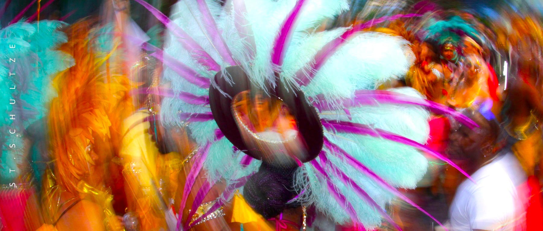 On the streets of Berlin. People come to the city to explore and experience the culture. Events like the Carnival of the Cultures literally draw millions of tourists to the city. Folks go home with memories for life and the healing power of music. Photographed by St.Schultze.